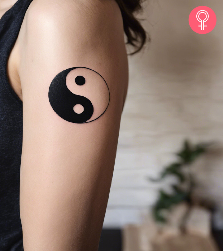 A balance tattoo on a woman’s arm