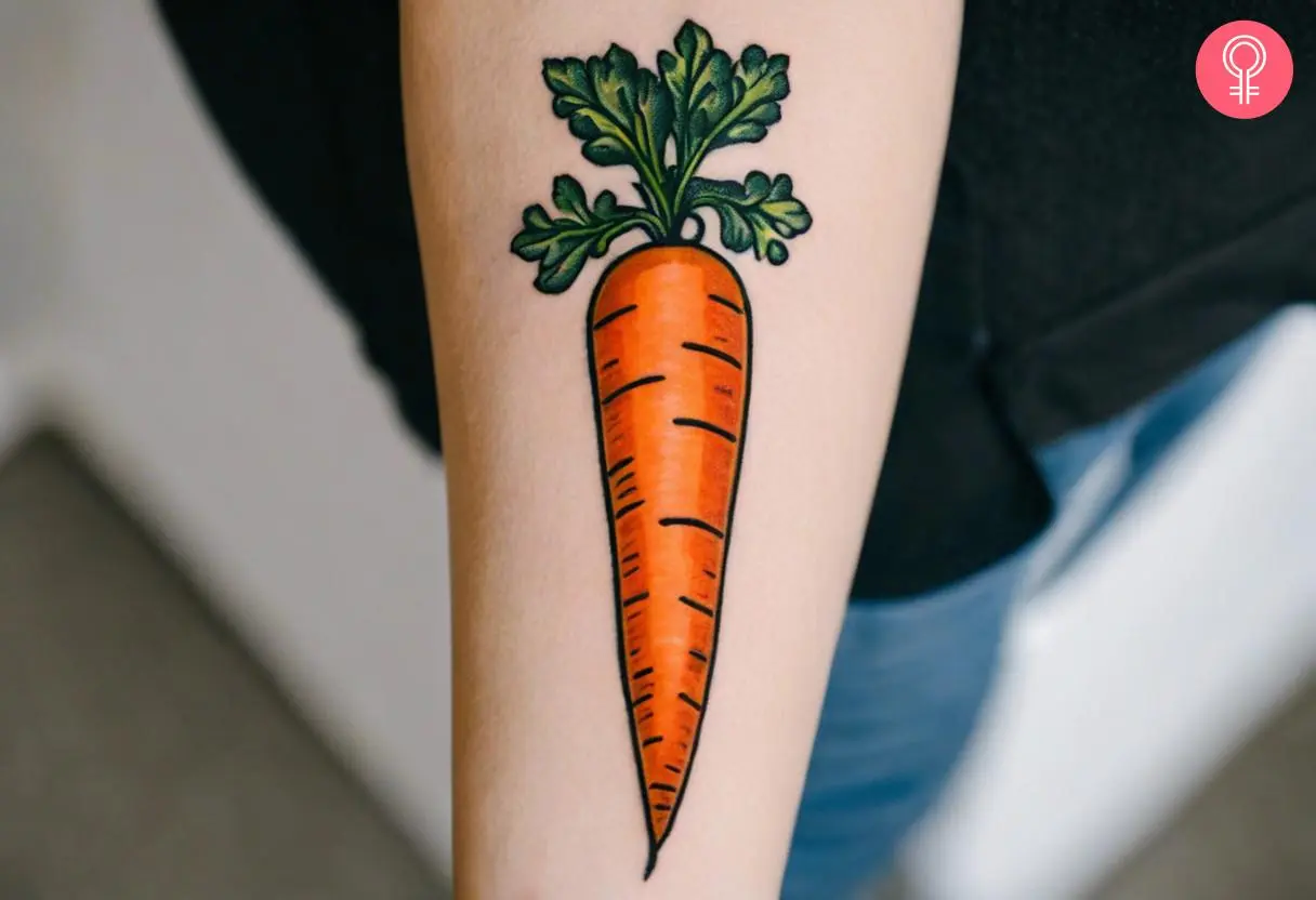 A colorful carrot tattoo inked on the forearm