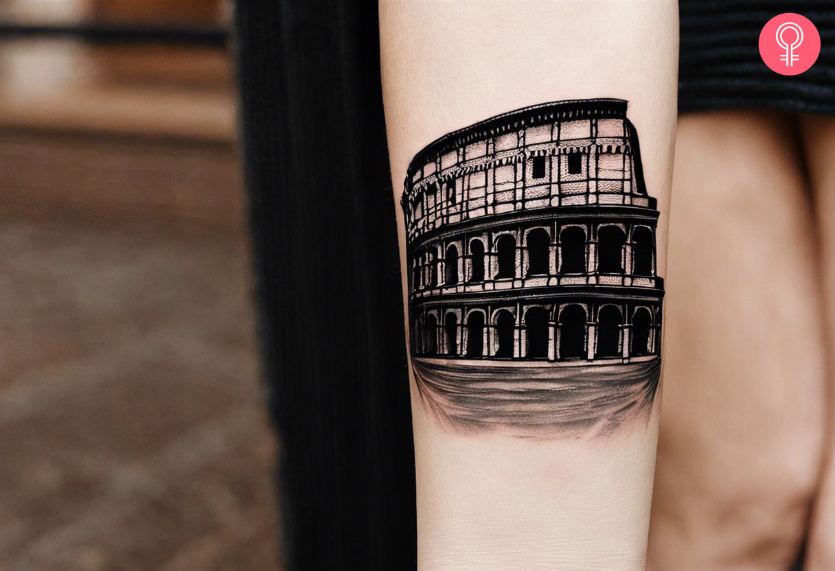 A colosseum tattoo on the forearm of a woman