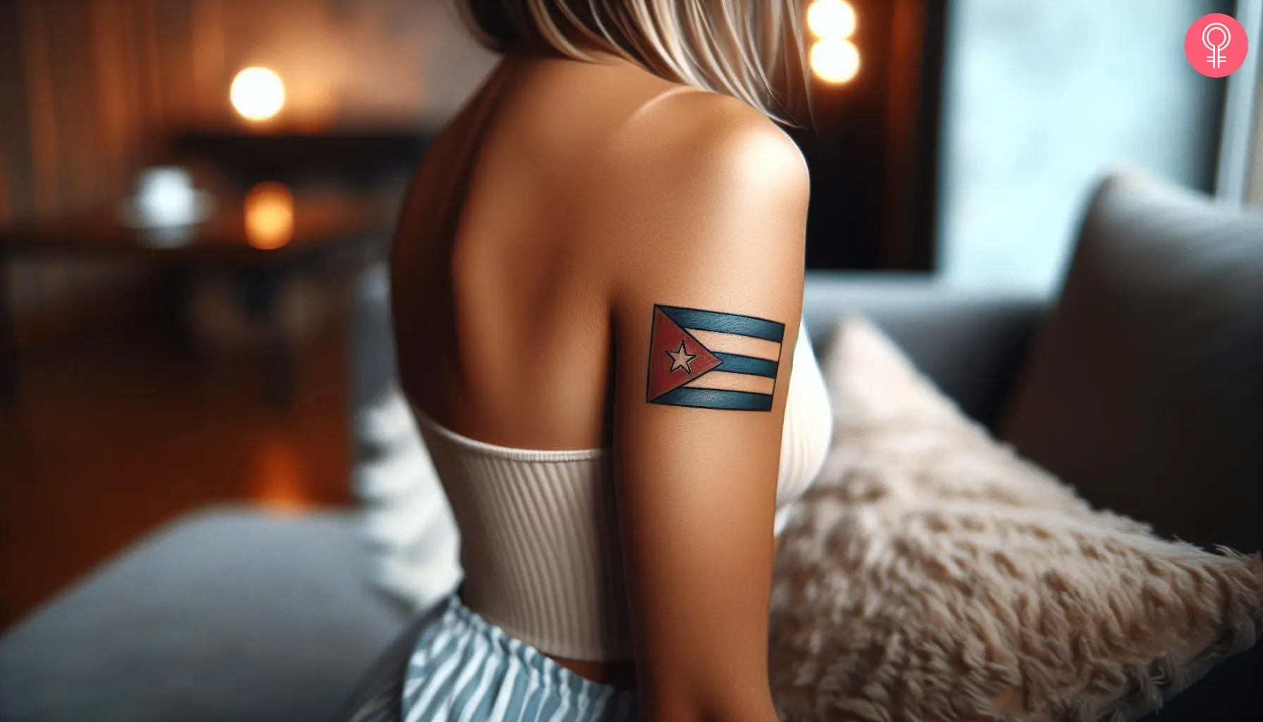 A cuban flag tattoo on the upper arm of a woman