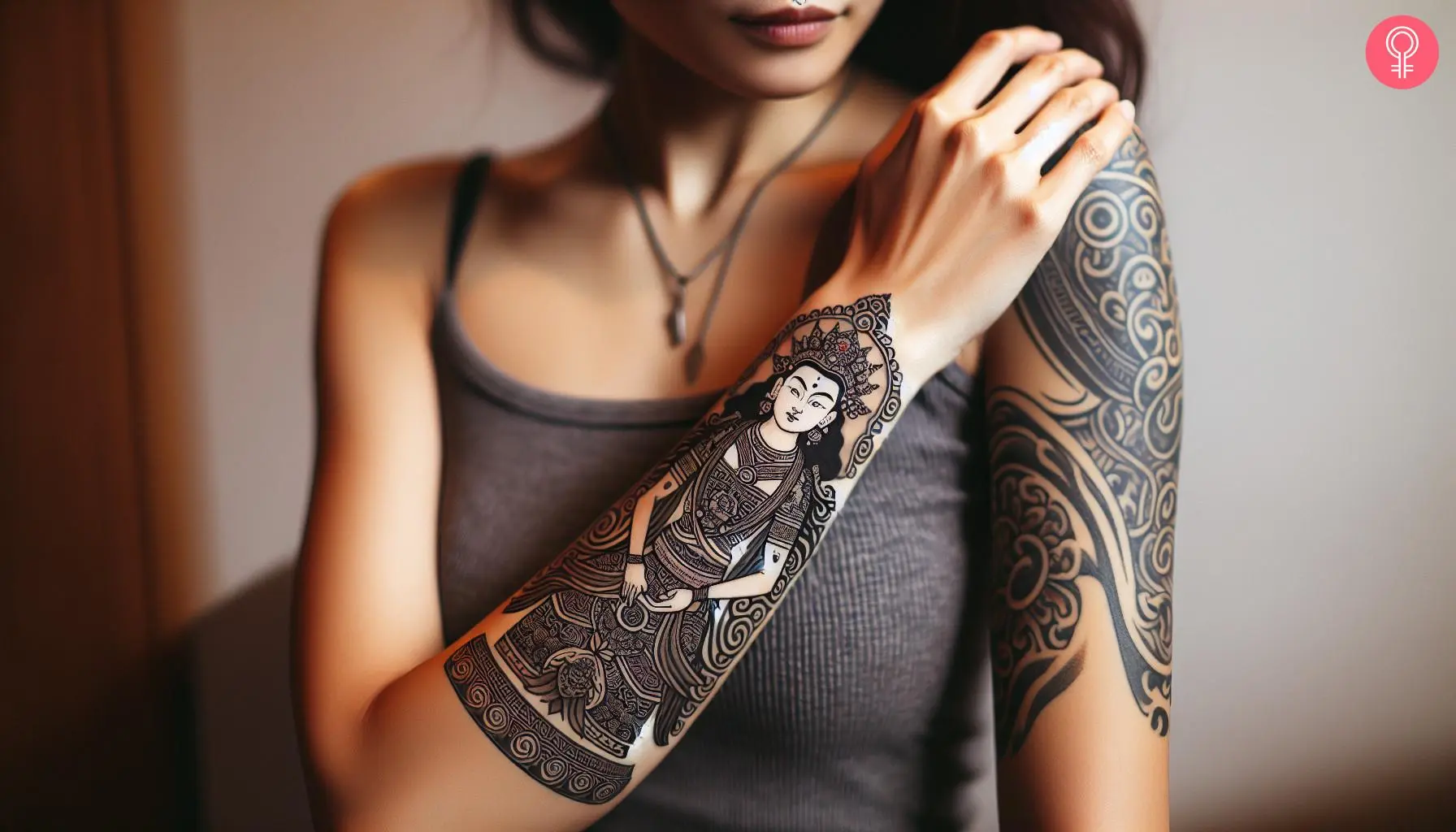 A forearm tattoo of a Tibetan Thangka