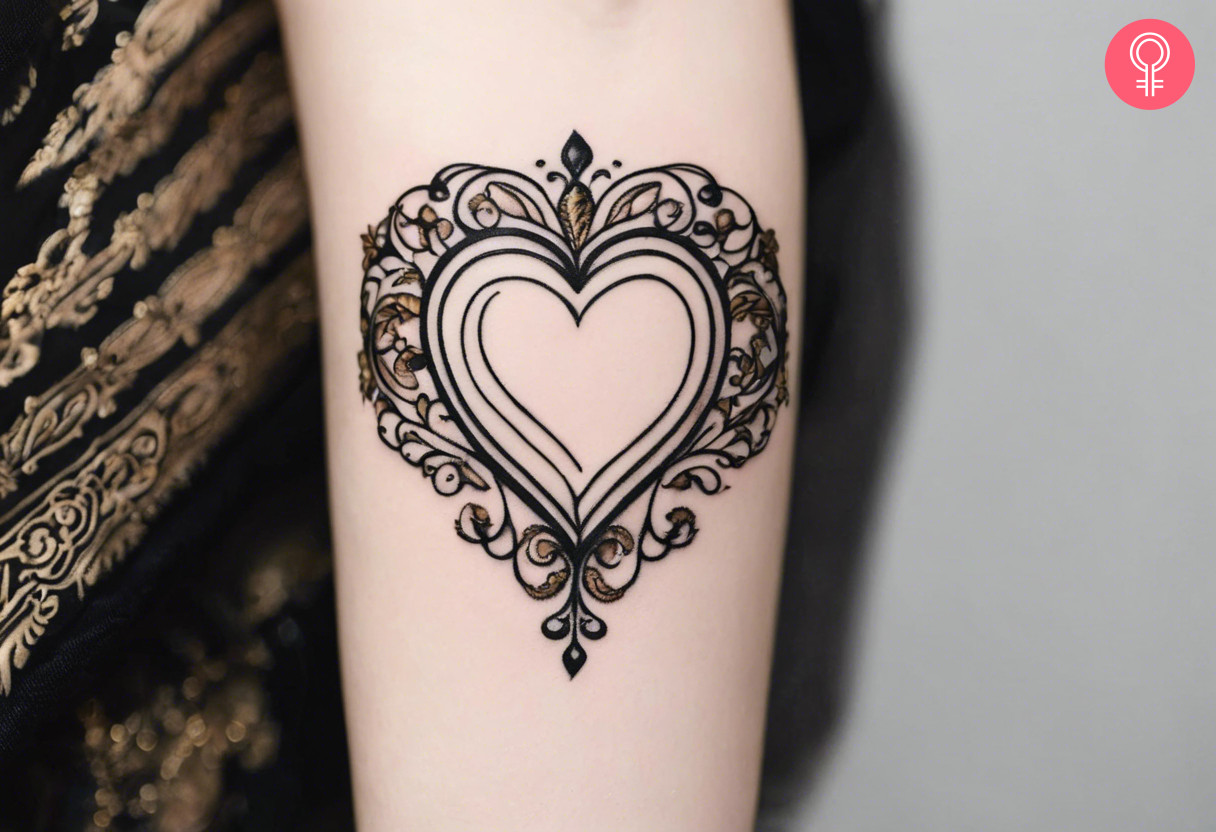 A heart baroque tattoo on the forearm