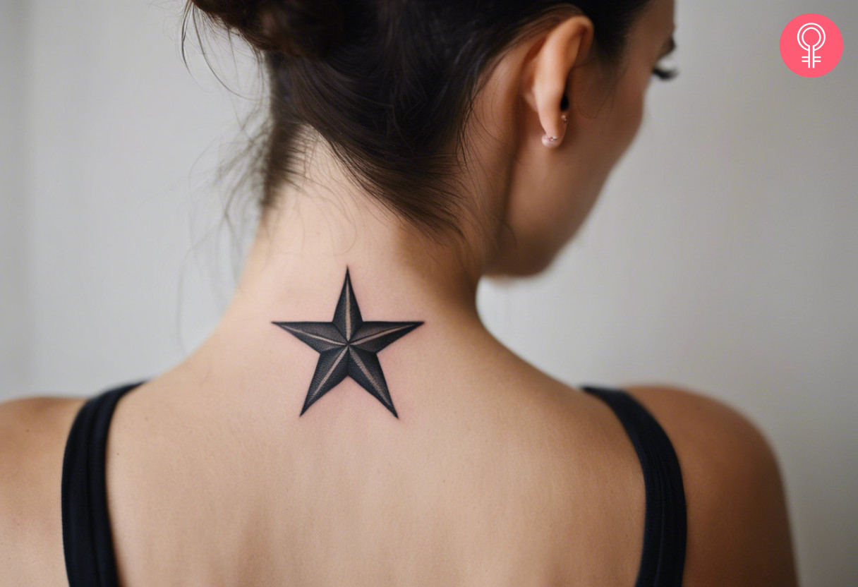 A lesbian star tattoo in black ink on the back of the neck