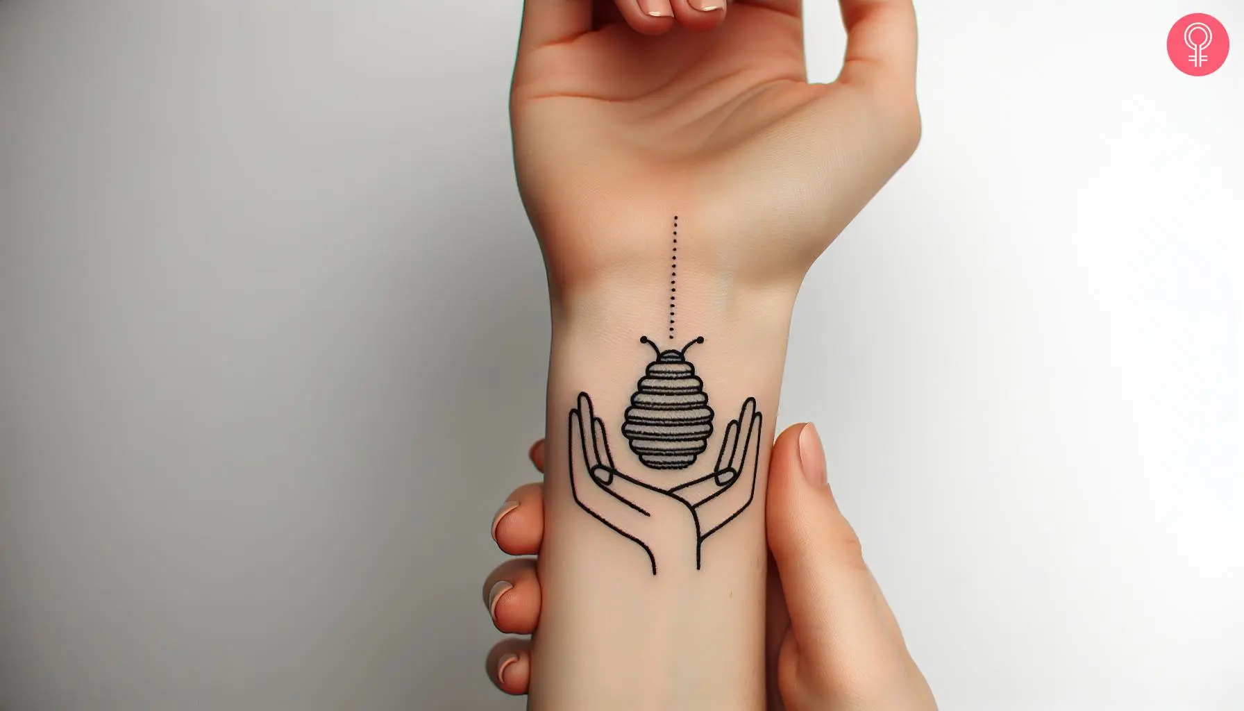 A line art beehive tattoo on the wrist