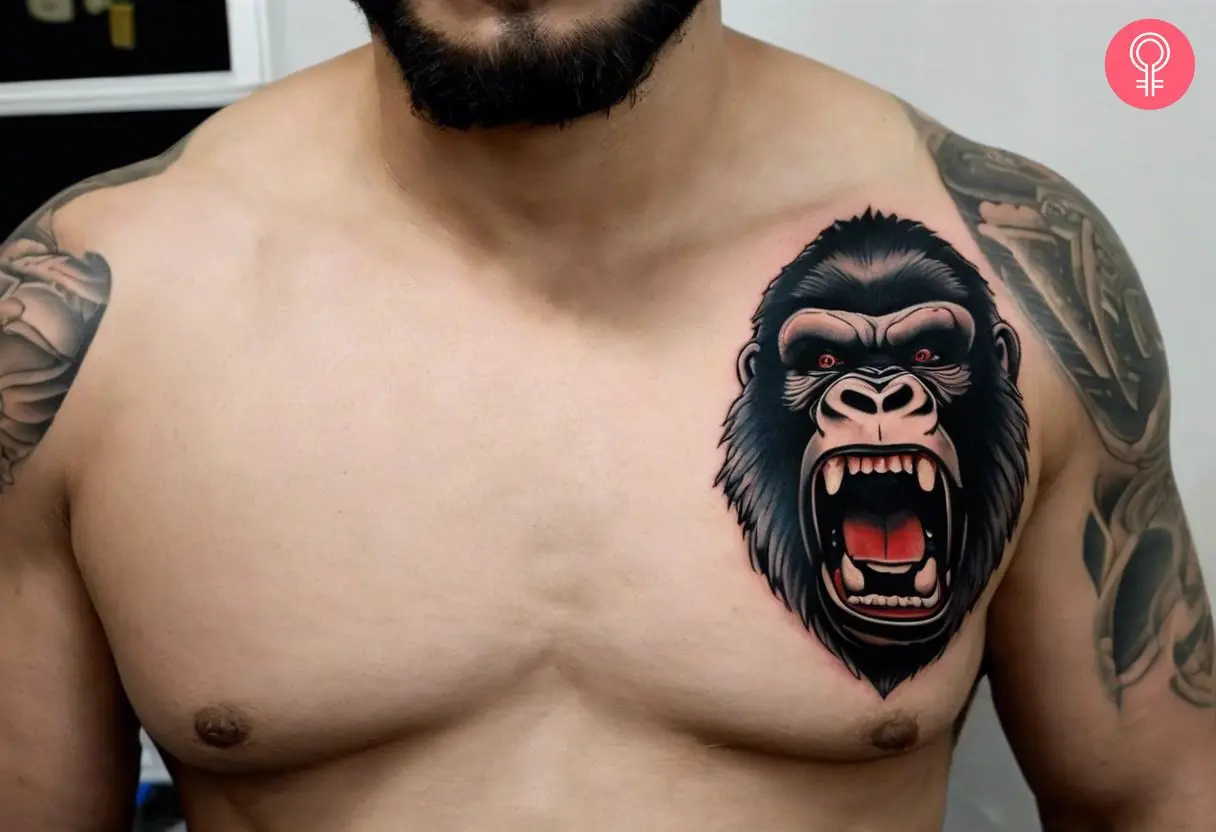 A man wearing a King Kong face tattoo on the front shoulder