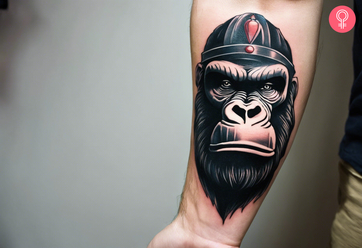 A man wearing a King Kong forearm tattoo