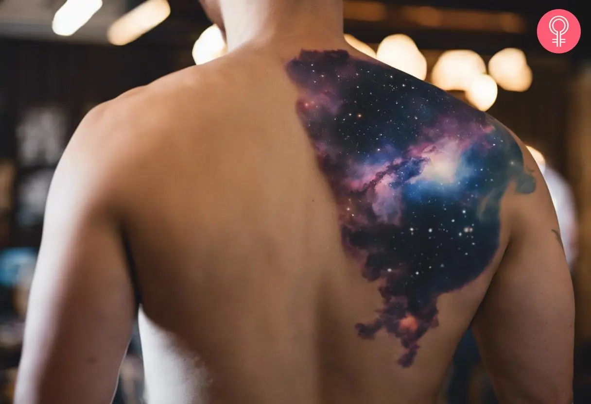 A man wearing a comet tattoo on the upper back 