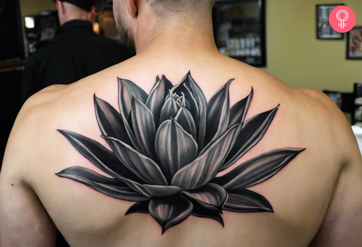 A man wearing a tequila agave tattoo on the back.