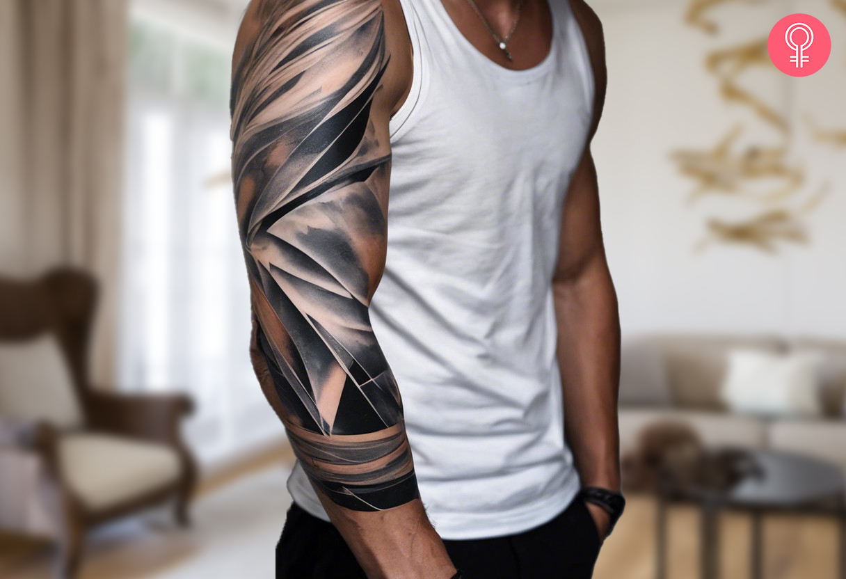 A man wearing an abstract marble tattoo on the arm