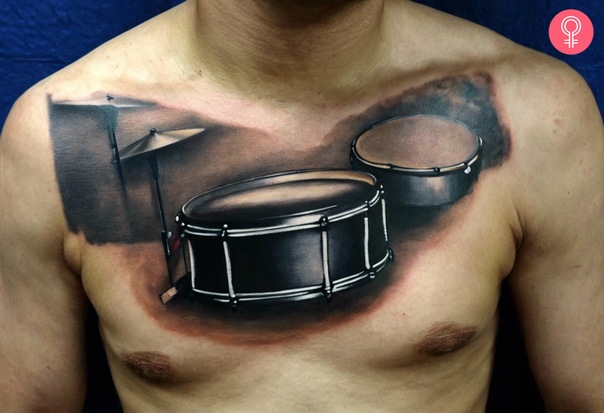 A man with a 3D drum tattoo on the chest