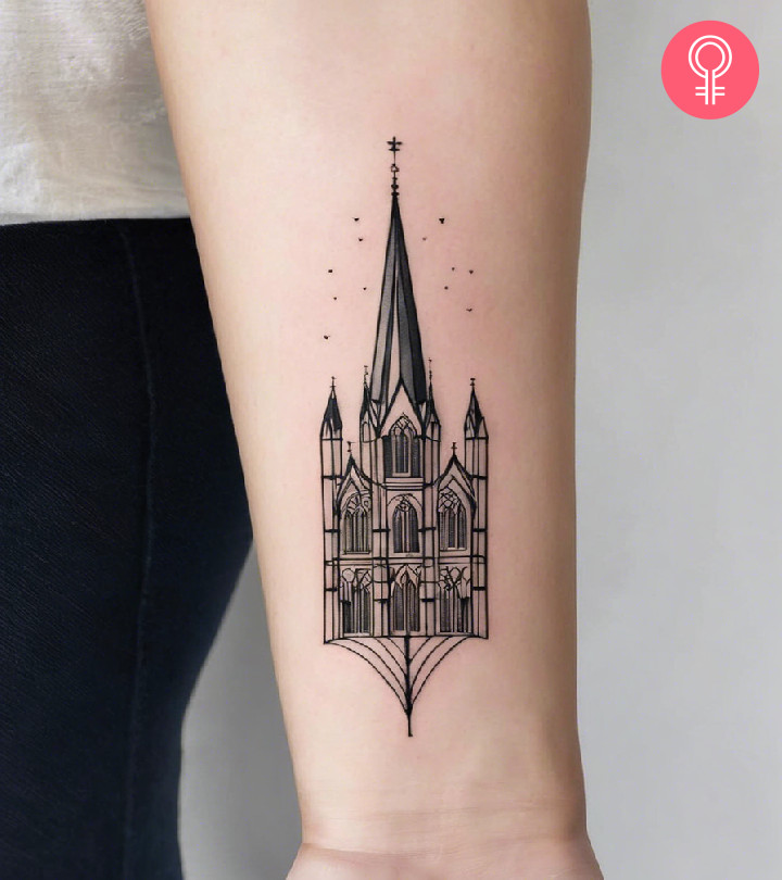 A minimalist cathedral tattoo on the forearm