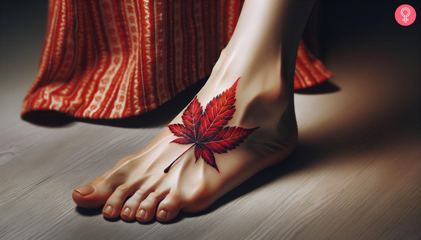 A Japanese maple leaf tattoo on a woman's foot