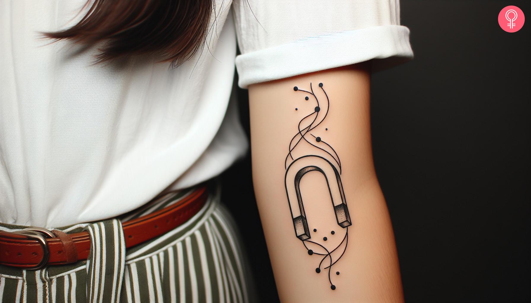 A minimalist tattoo on the wrist with a magnet