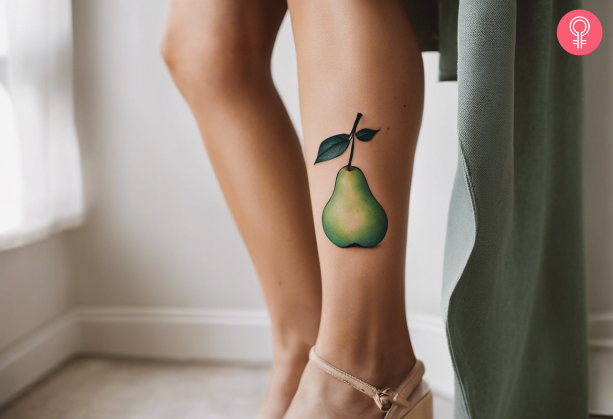 A pear tattoo on a woman’s leg