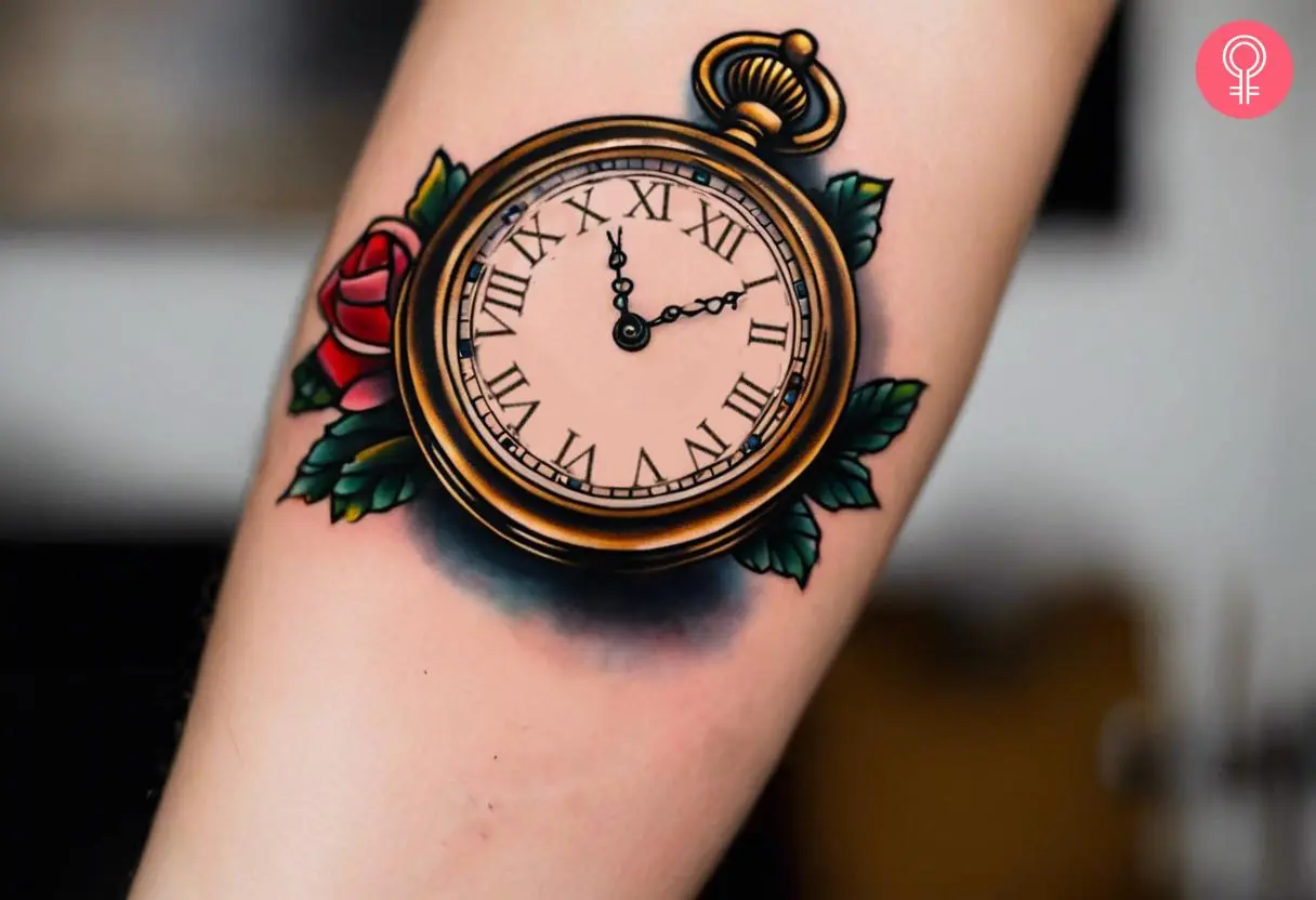 A pocket watch and rose tattoo on a woman’s forearm