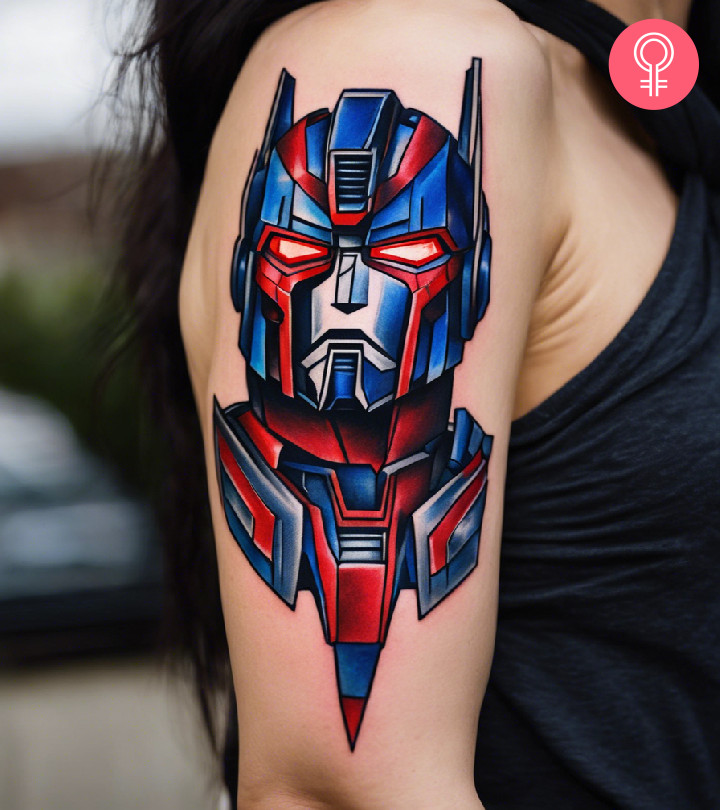 A portrait tattoo of optimus prime on the upper arm