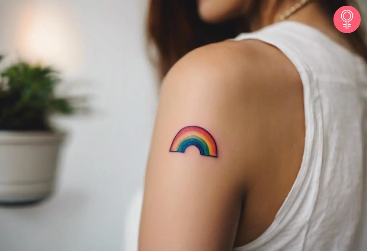 A rainbow tattoo on the upper arm