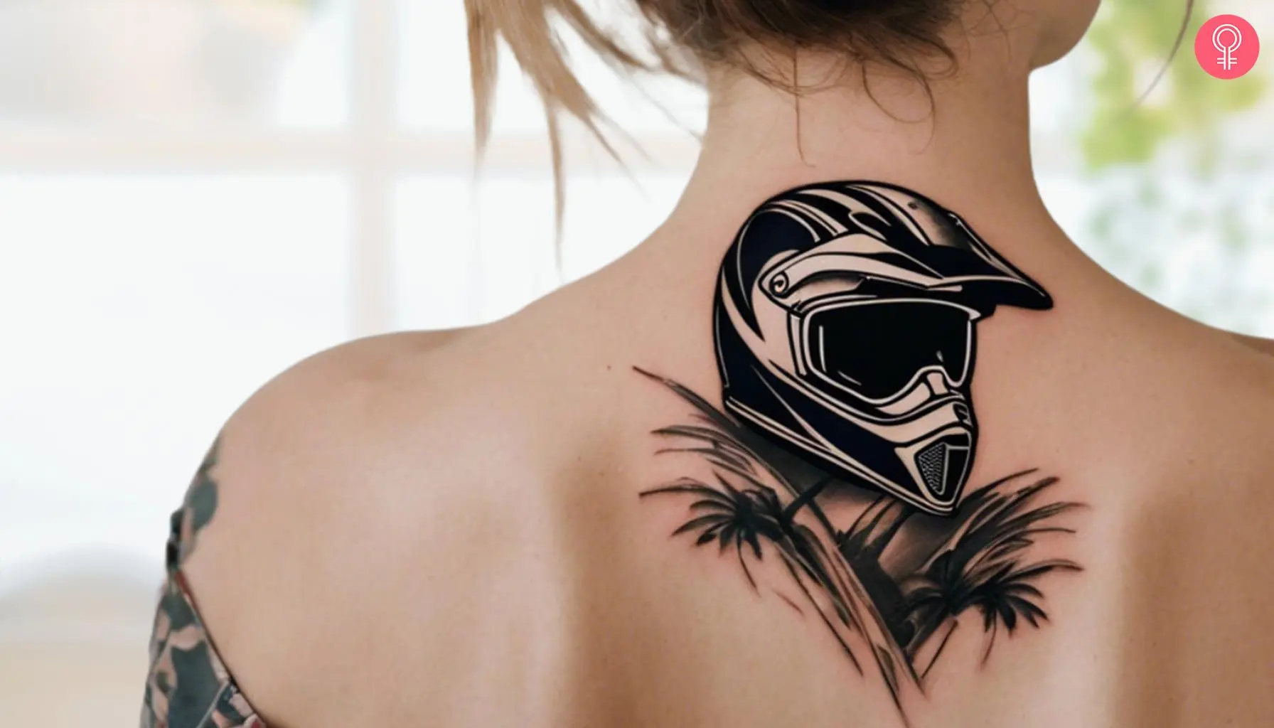 A realistic black-and-white motocross helmet tattoo on a woman’s neck