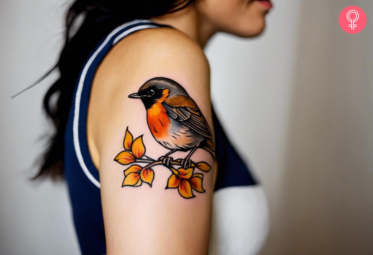 A robin tattoo on the upper arm