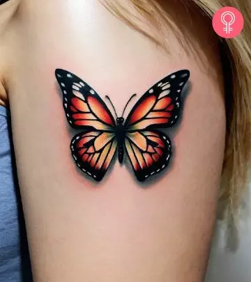 A beautiful blue butterfly tattoo on a woman’s arm