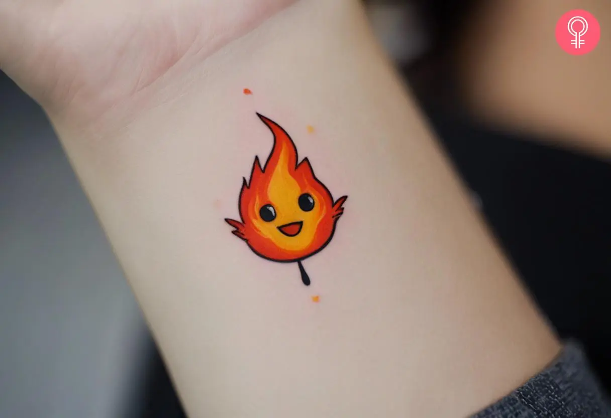 A small and cute Calcifer tattoo on the wrist