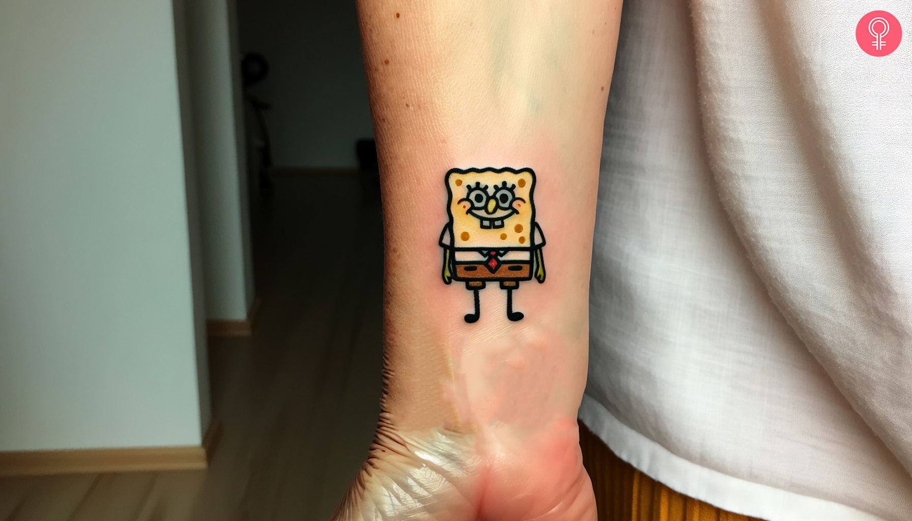 A small spongebob tattoo near the wrist