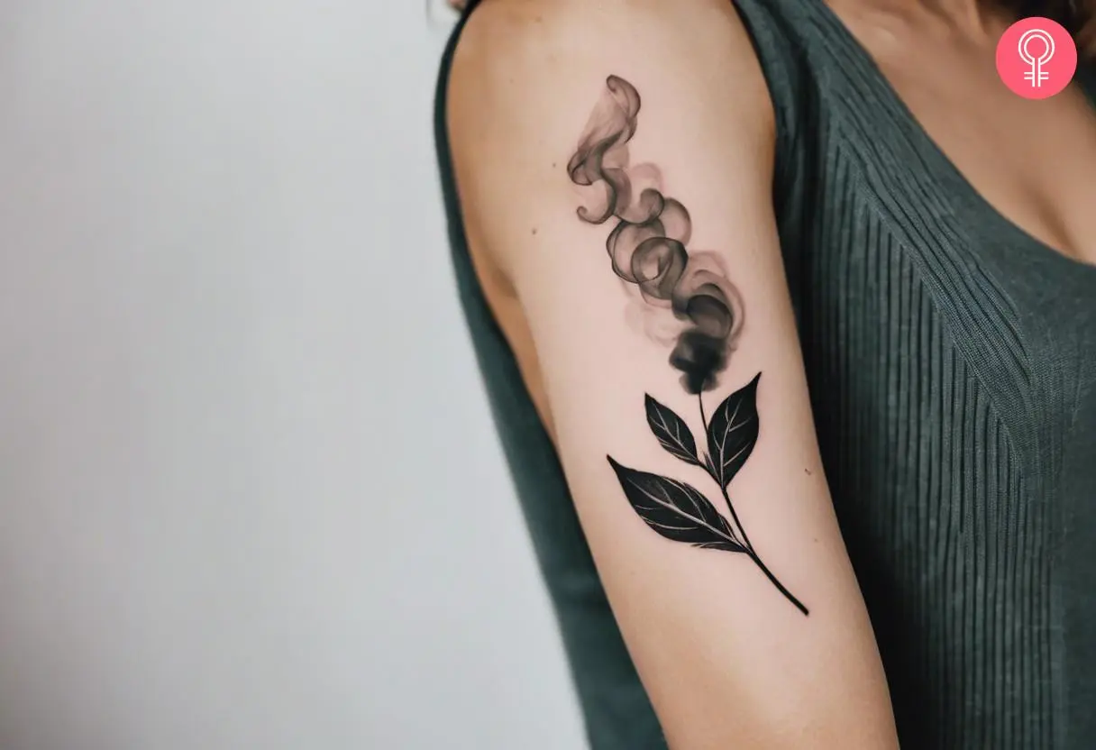 A smoke tattoo filler on a stem etched on a woman’s upper arm