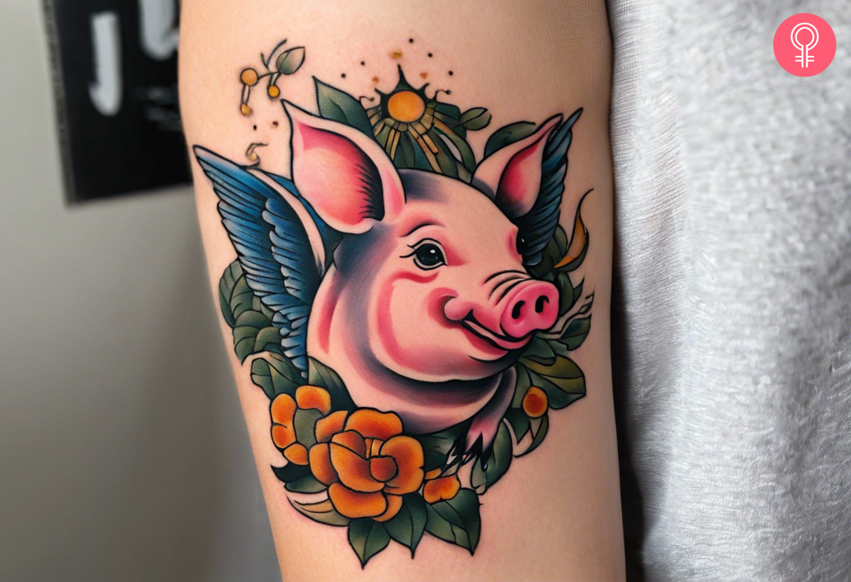 A tattoo of a flying pig on a woman’s arm