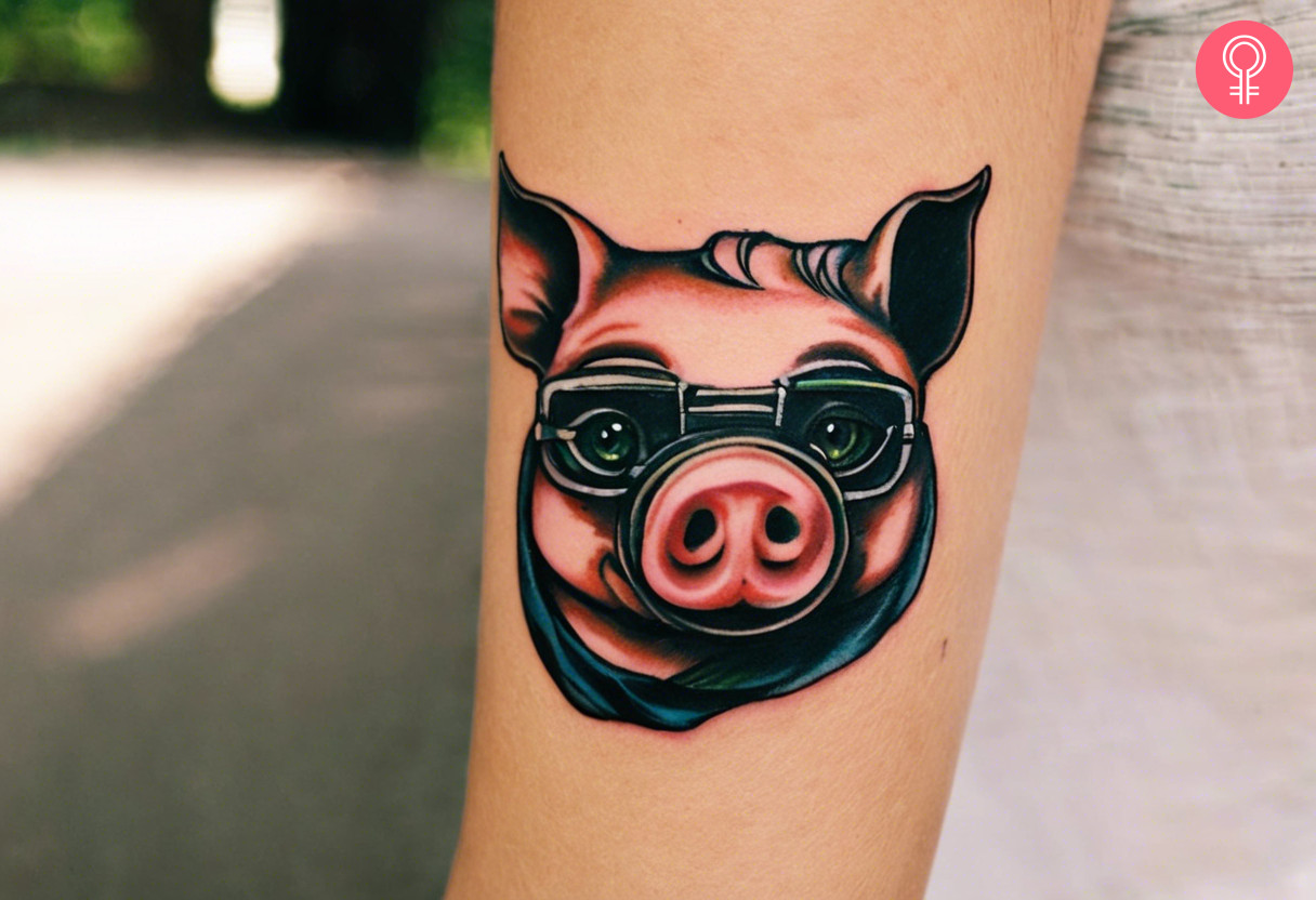 A tattoo of a pig face on a woman’s arm