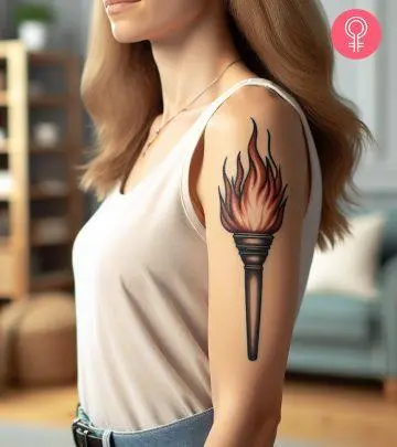 Woman with a Baphomet head tattoo on the upper arm