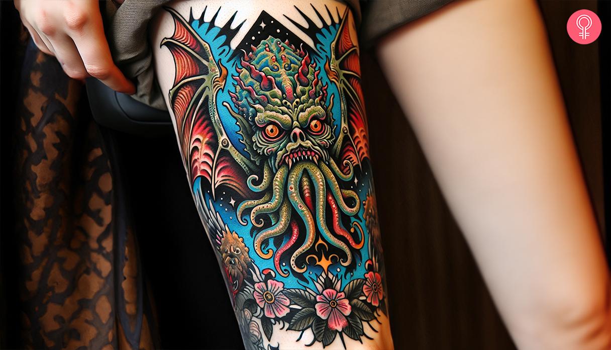 A traditional Cthulhu tattoo on a woman's thigh