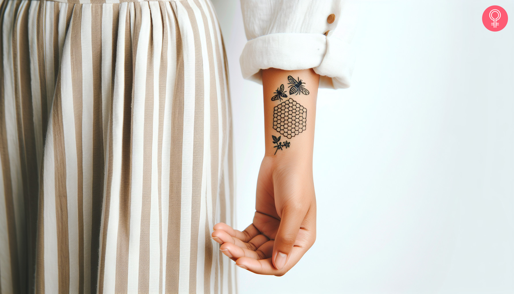 A traditional beehive pattern tattoo on the forearm of a woman