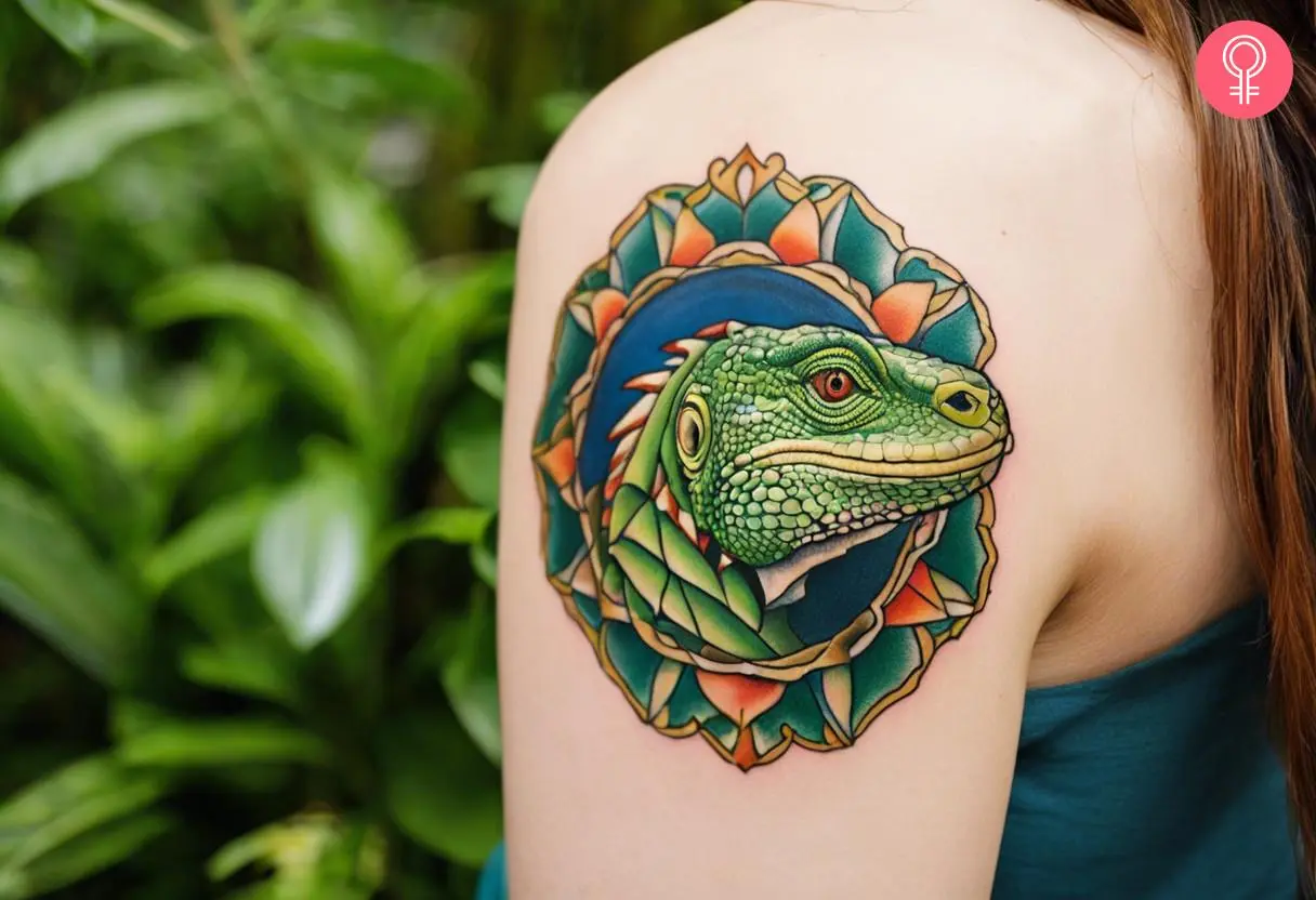 A traditional green iguana head tattoo inked on the arm