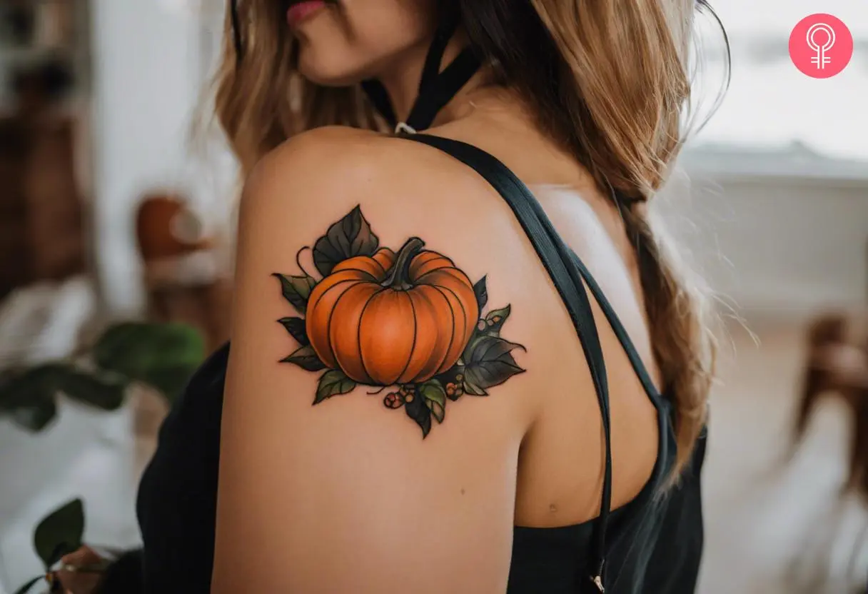 A traditional pumpkin tattoo on the shoulder of a woman