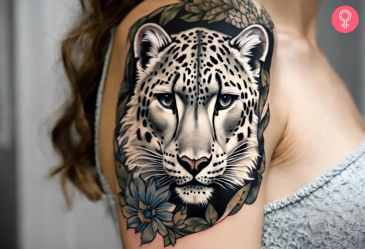 A traditional snow leopard tattoo on a woman’s arm