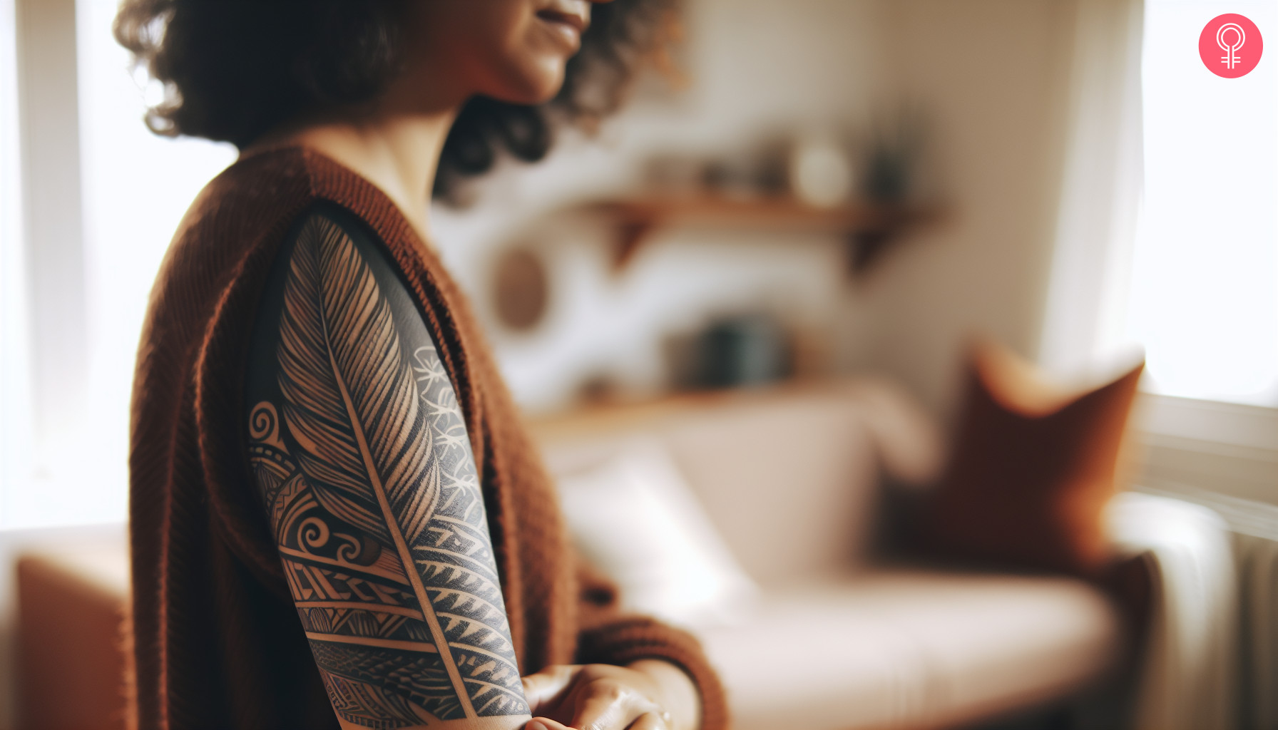 A tribal Maori feather tattoo on upper arm