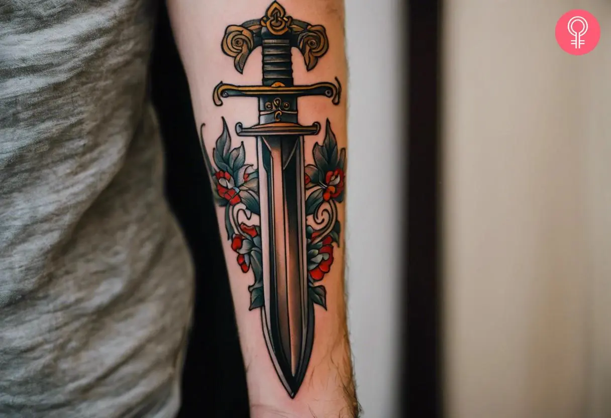 A vintage dagger tattoo on the forearm