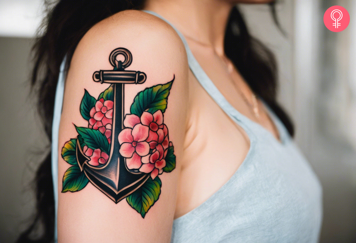 A vintage hydrangea tattoo on the upper arm of a woman