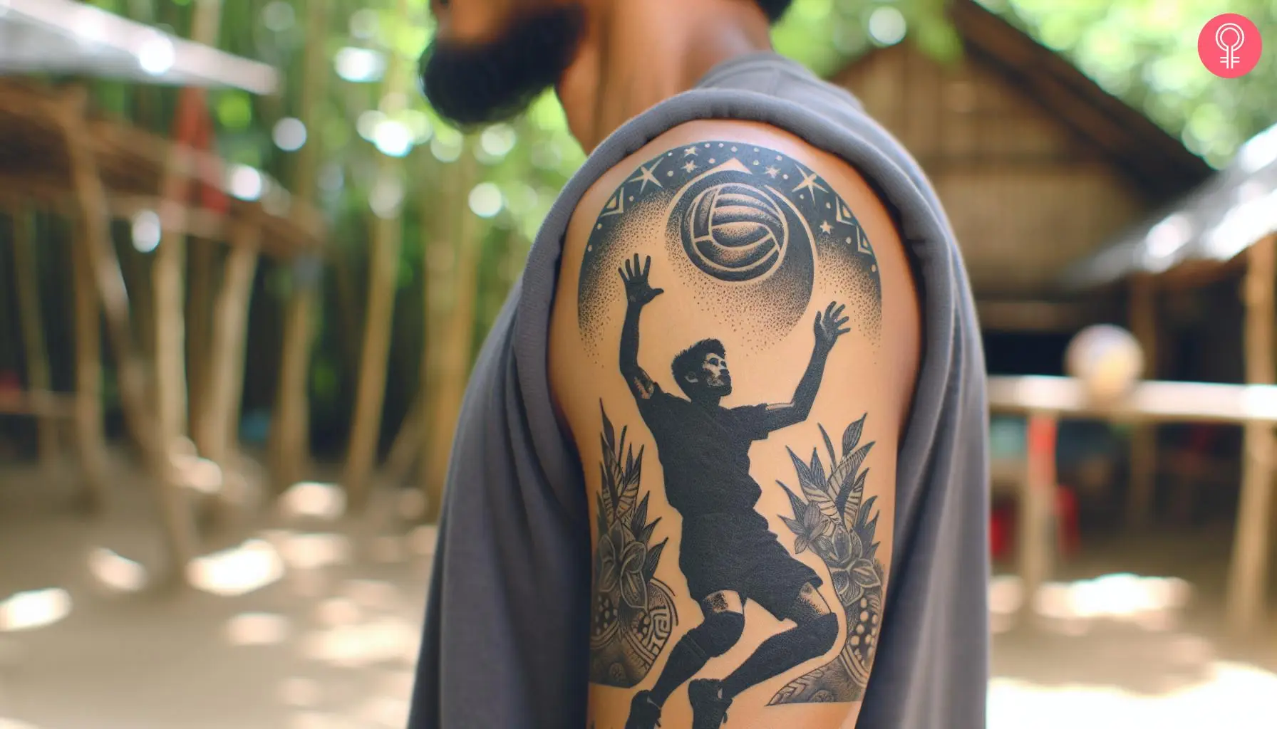 A volleyball tattoo spike on the upper arm of a man