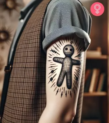 Woman with pitchfork tattoo on her arm