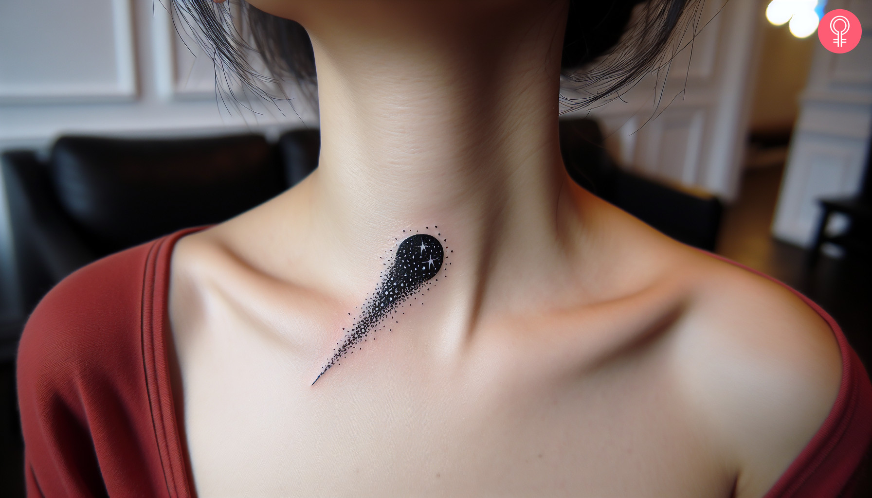 A woman wearing a black and white comet tattoo on the collarbone