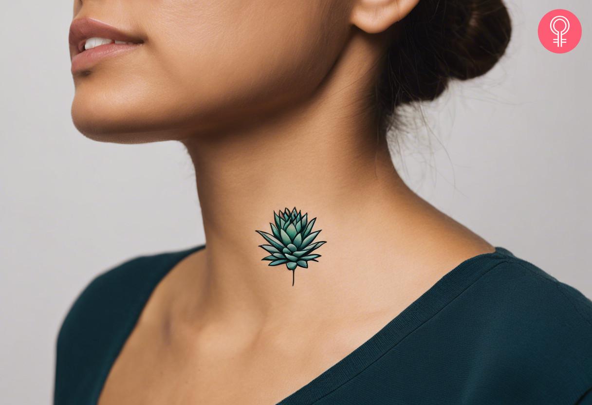 A woman with a minimalist agave tattoo on her neck.