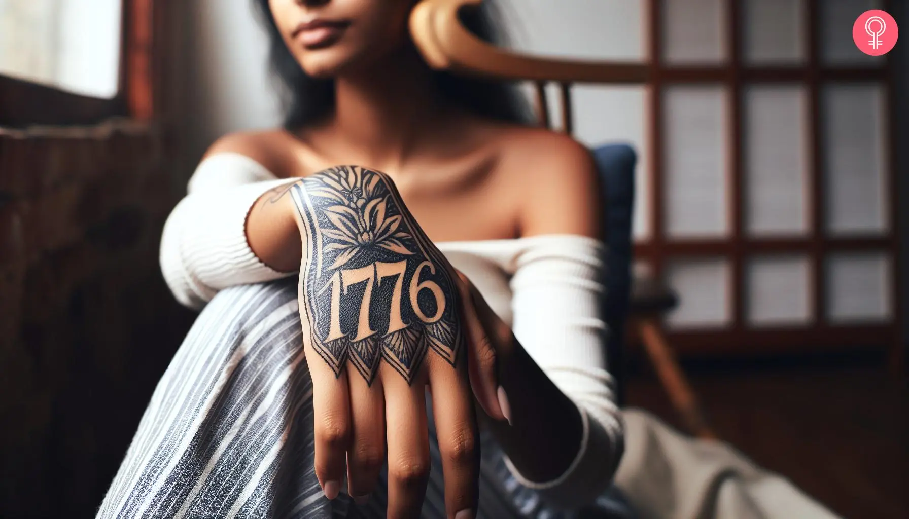 A woman with a 1776 tattoo on the hand