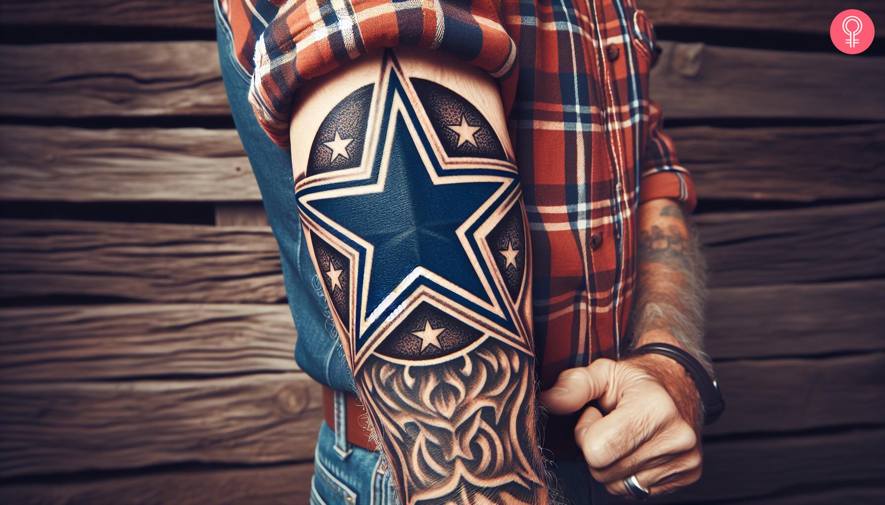 A woman with a Dallas Cowboys logo tattoo on her upper arm