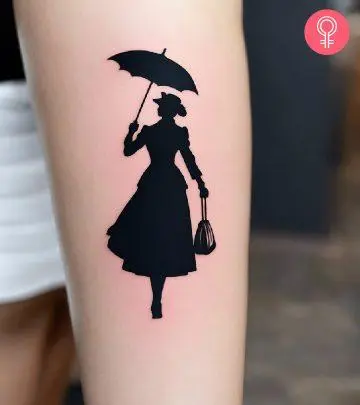 A woman with a black Mary Poppins tattoo on her arm