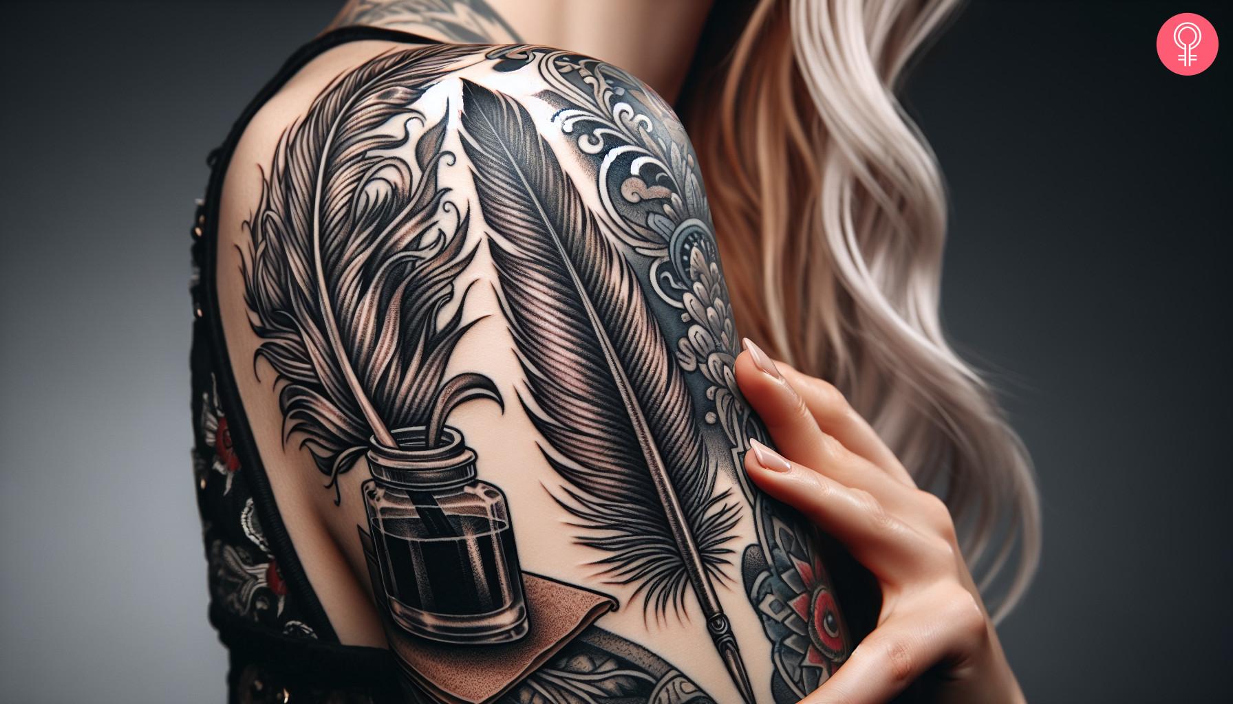 A woman with a black feather quill and ink tattoo on her upper arm