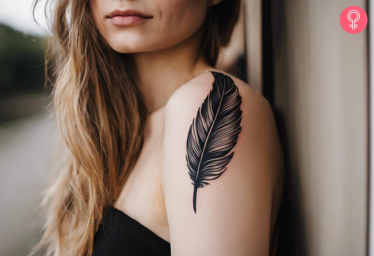 A woman with a black quill tattoo on her upper arm