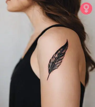 Woman with a blue jay tattoo on her upper arm