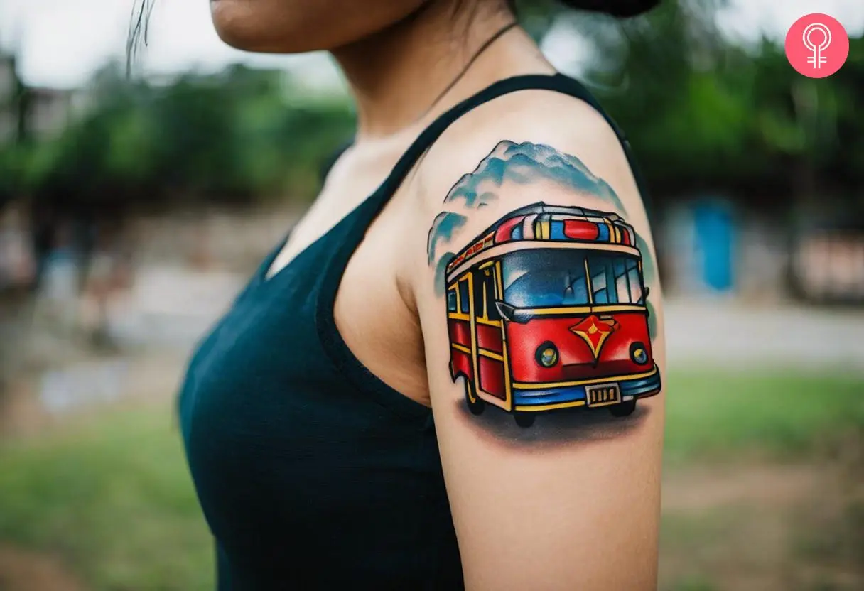 A woman with a colorful jeepney tattoo on her upper arm