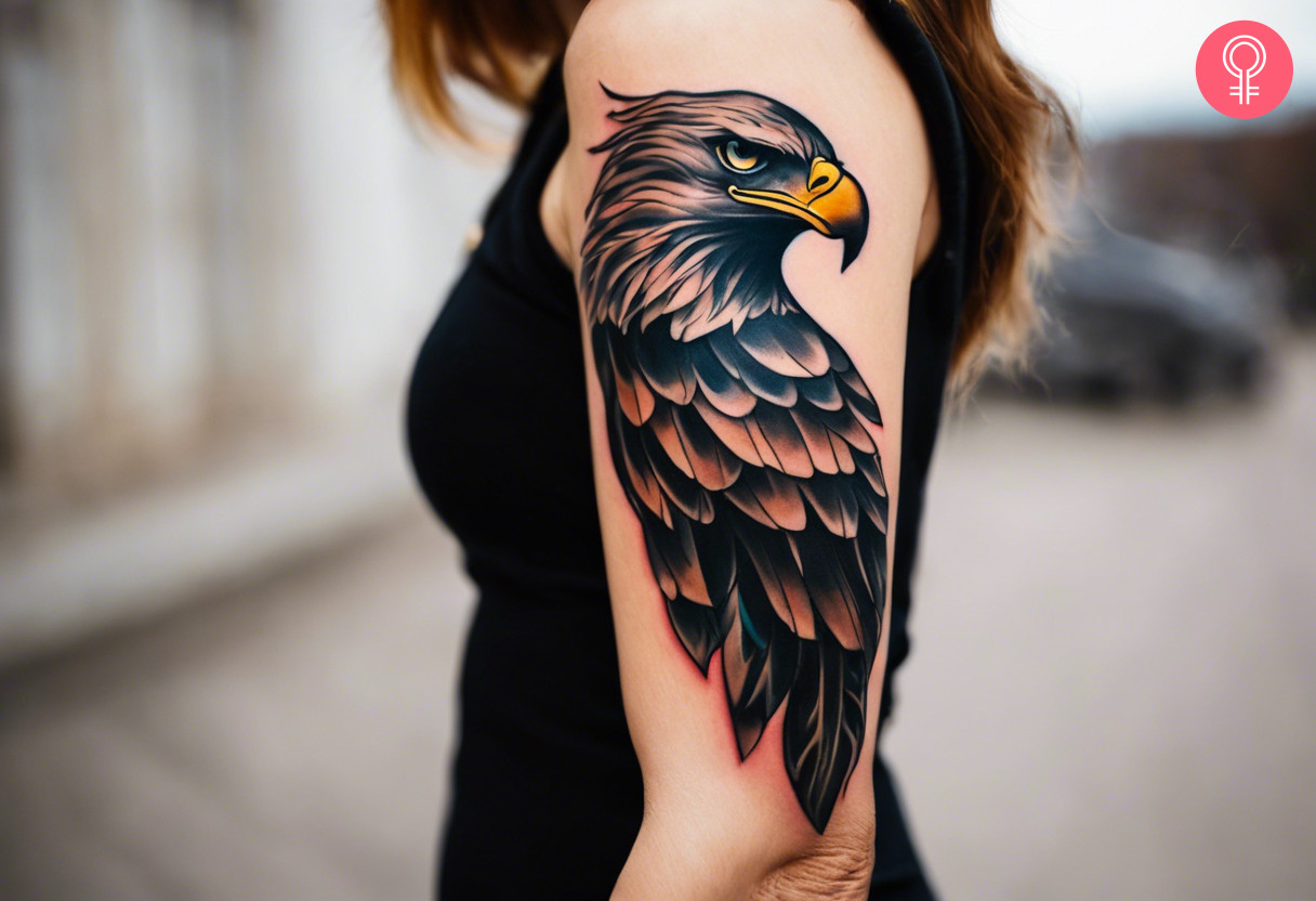 A woman with a fierce eagle tattoo on her upper arm